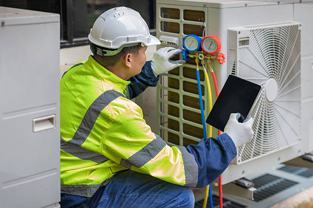 Professional Hvac technician working in Tuscumbia, AL